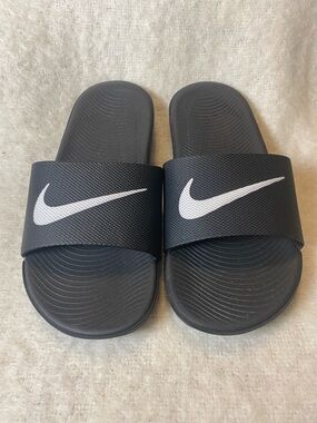 Nike Black Slides with White Swoosh Logo